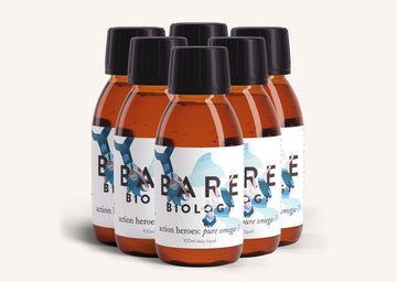 Six bottles of Bare Biology Action Heroes Pure Omega-3 liquid for children on a white background