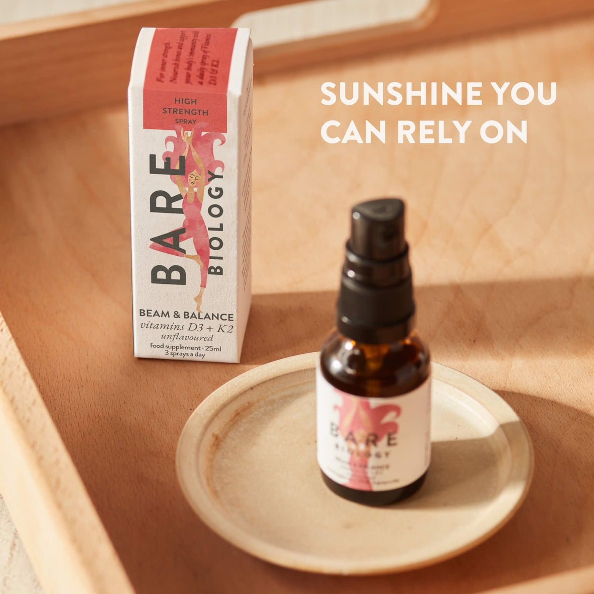 Bare Biology Beam and Balance Unflavoured product displayed on a ceramic dish on a tray next to the carton.