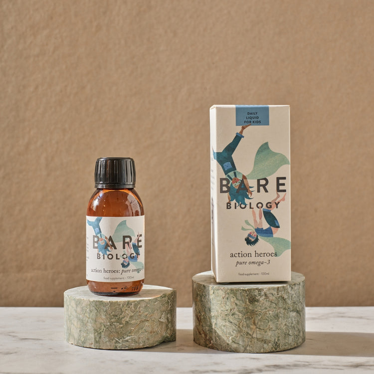 Bottle and box of Bare Biology liquid Omega-3 product on a neutral background.