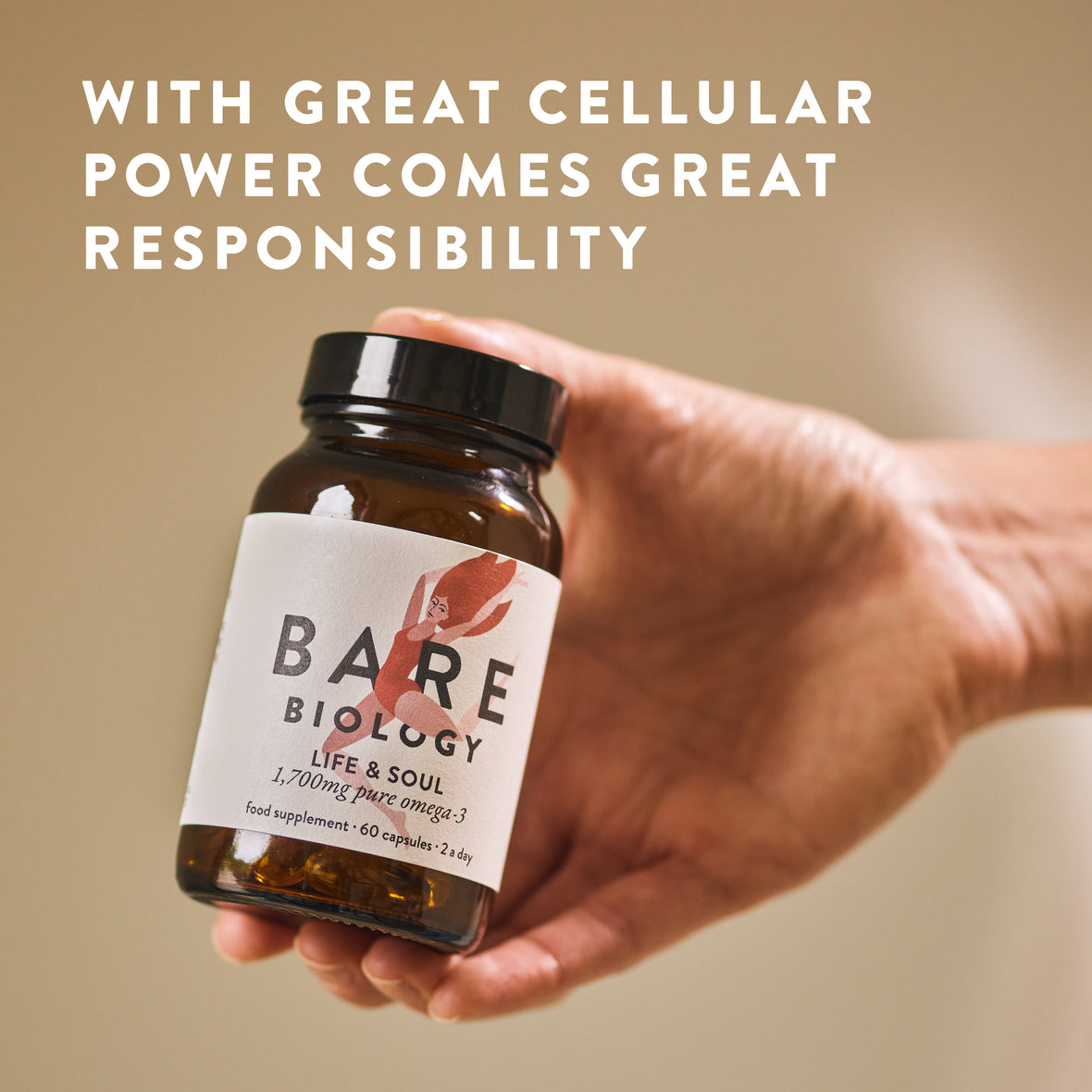 A hand holds a bottle of Bare Biology Life & Soul Omega-3 Fish Oil Daily Capsules against a beige background. Above, large white text reads: WITH GREAT CELLULAR POWER COMES GREAT RESPONSIBILITY, highlighting heart and brain benefits.