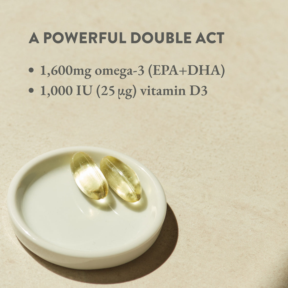 Two rise & Shine omega-3 + vitamin D capsules on a ceramic dish with dose details written in text above.