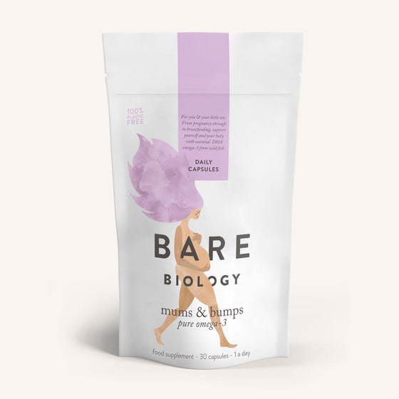 One white pouch of Bare Biology Mums & Bumps Omega-3 Fish Oil Capsules for Pregnancy, featuring an illustrated woman with pink hair, highlighting DHA for developing babies and containing a label for daily capsules.