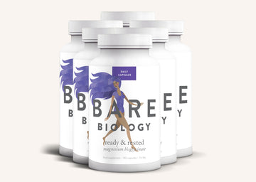 Rows of white tubs of Bare Biology Ready and Rested Magnesium supplement on a white background