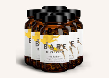Row of Bare Biology Rise and Shine supplement jars on a wide white background