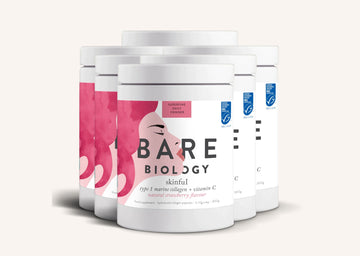 Rows of white containers of Bare Biology Skinful and Vitamin C collagen powder on a white background