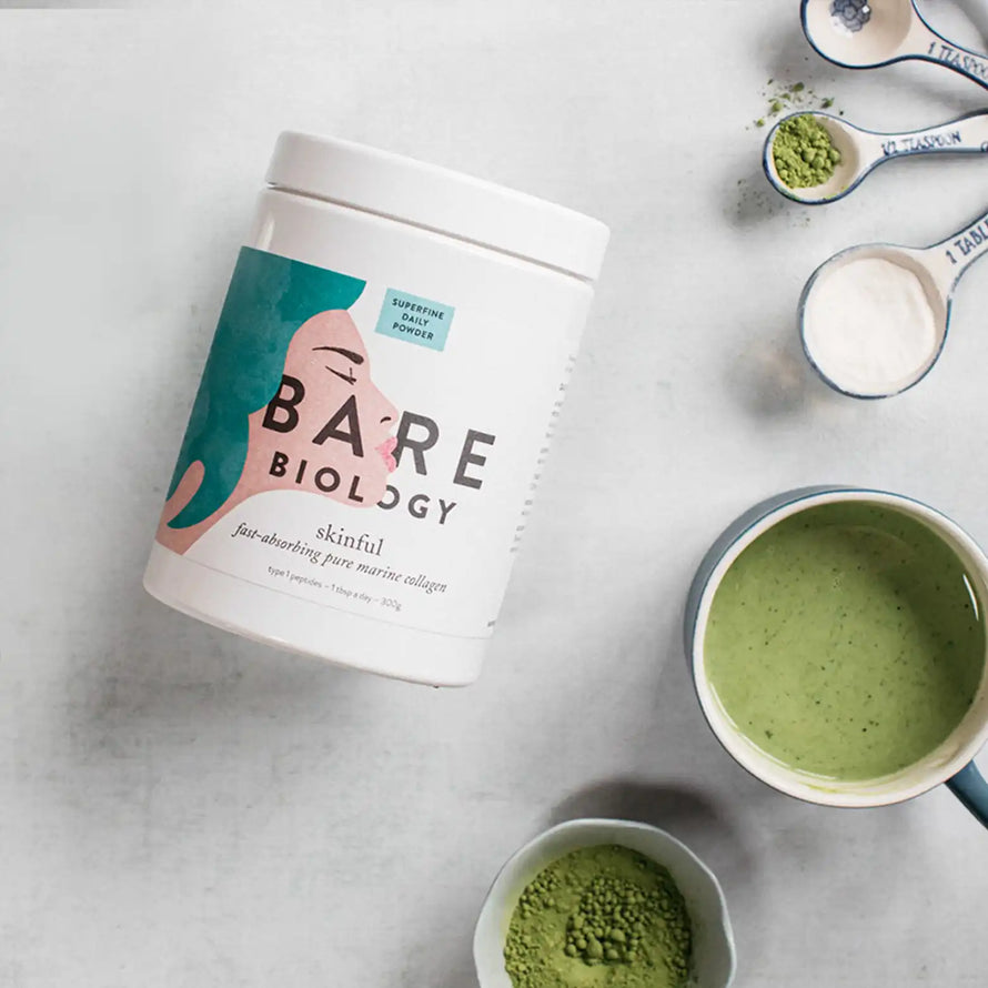 bare biology skinful marine collagen powder next to matcha latte