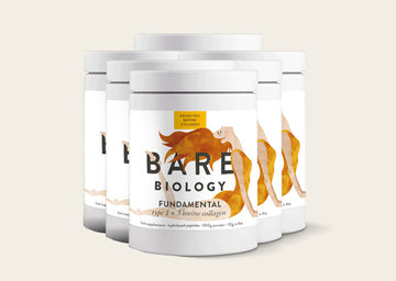 6 containers of Bare Biology bovine collagen supplement on a light background