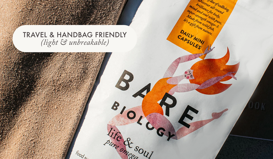 bare biology life & soul omega 3 mini fish oil capsules pouch in a cream suede bag with notebooks