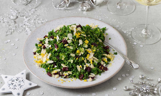 Crispy kale, cranberry and toasted almond salad with a clementine and ginger dressing