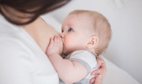 a woman breastfeeding her baby