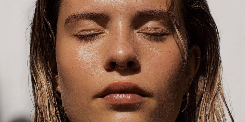 a woman with glowing skin