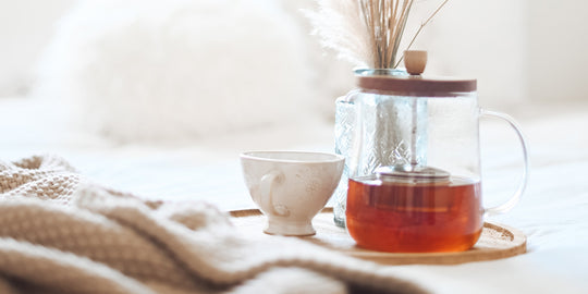 herbal-tea-in-bed-with-blanket