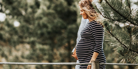pregnant-woman-walking-over-a-bridge