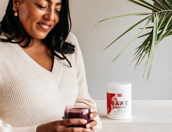woman holding Collagen Supplements