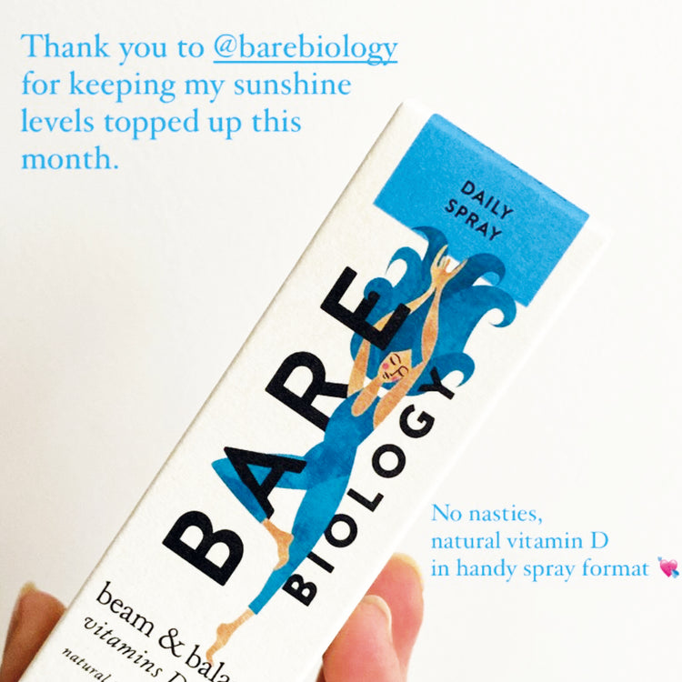 social media post with a hand holding bare biology vitamin d + k2 spray