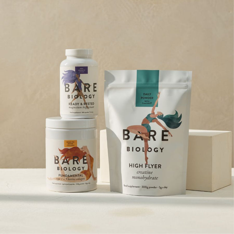 Bare Biology magnesium bisglycinate pot, placed on top of a bovine collagen tub displayed next to a creatine monohydrate pouch all with colourful illustrations on the packaging displayed against a neutral background.