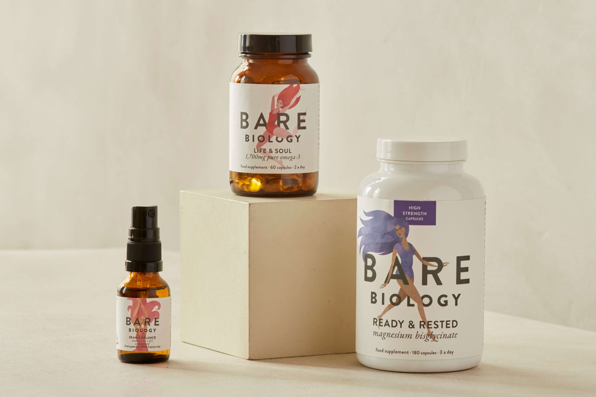 Beam and Balance spray and Ready and Rested Magnesium capsules on stone patterned cylindrical stands