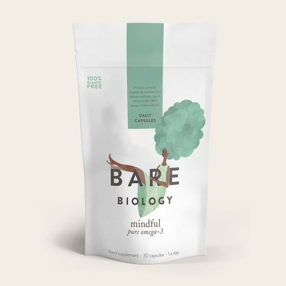 Bare Biologys Pure DHA Omega-3 Capsules have minimalist packaging with an illustration of a woman with tree-like hair, symbolizing mindfulness. The pack contains 30 capsules and is made from 100% plastic-free materials.