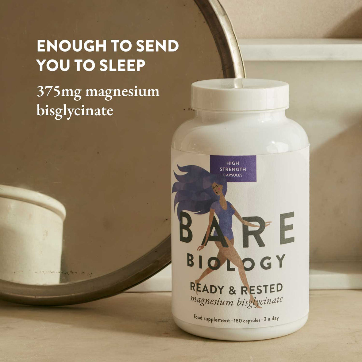 Colourfully illustrated Bare Biology supplement bottle with text about magnesium bisglycinate on a neutral background.