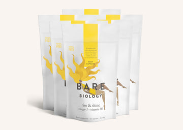Rows of Bare Biology Rise and Shine Omega-3 and Vitamin D3 supplement pouches on a white background