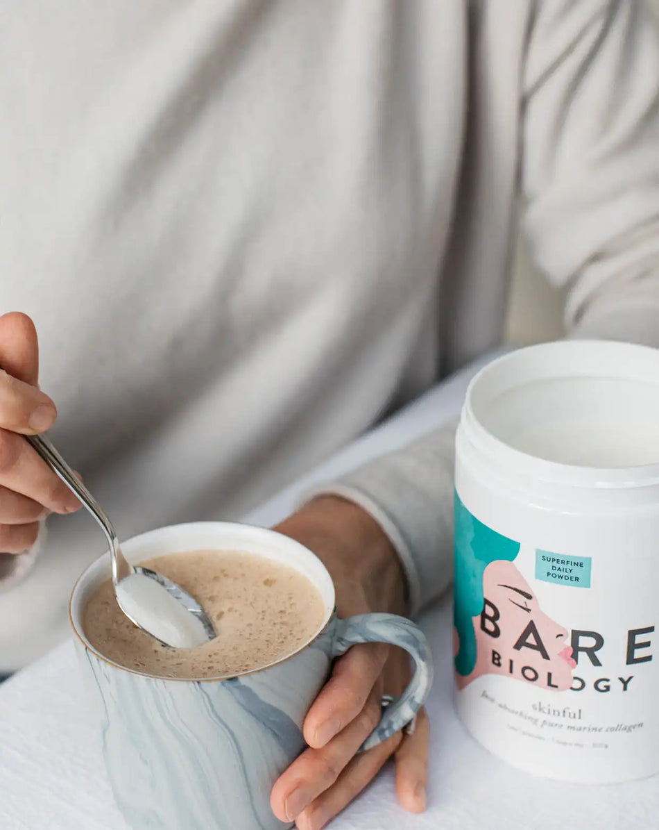 bare biology skinful marine collagen powder being mixed into coffee