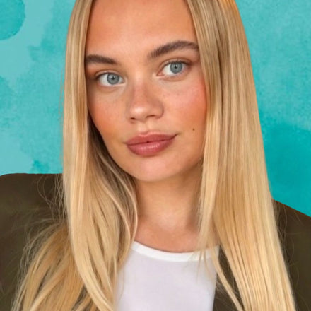 Headshot of Brand Manager with long blonde hair against a teal background