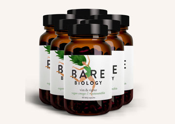 Six jars of Bare Biology Vim and Vigour Vegan Omega-3 supplement with colourful green label on a white background