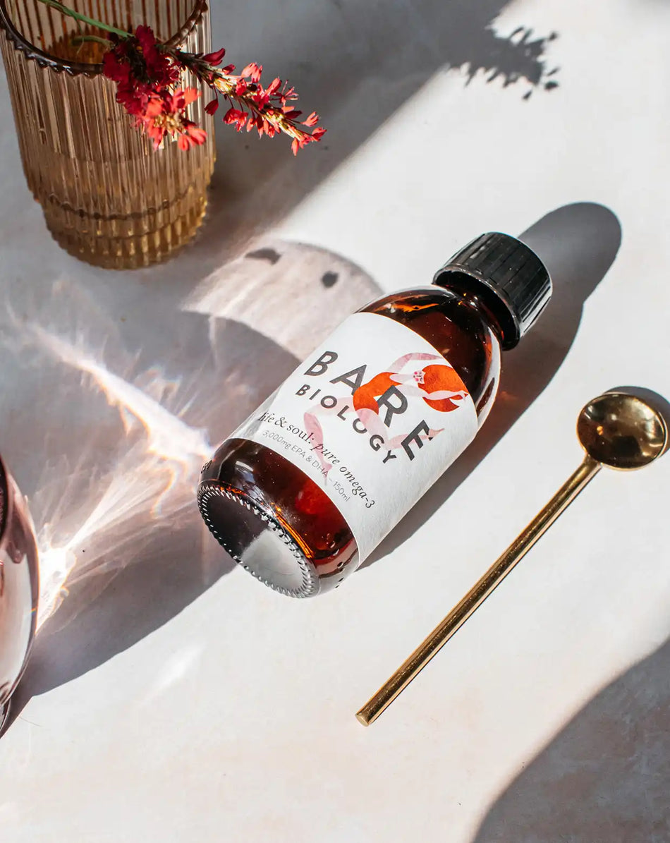 bare biology life and soul omega 3 liquid bottle with golden spoon