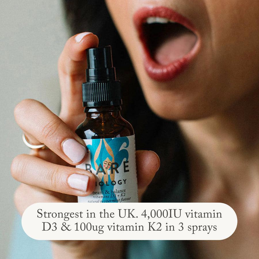Woman spraying Beam & Balance vitamin D3 spray into her mouth. Our Vitamin D3 and K2 spray is the strongest ni the UK. 4,000IO vitamin D3 & 100ug vitamin K2 in 3 sprays.