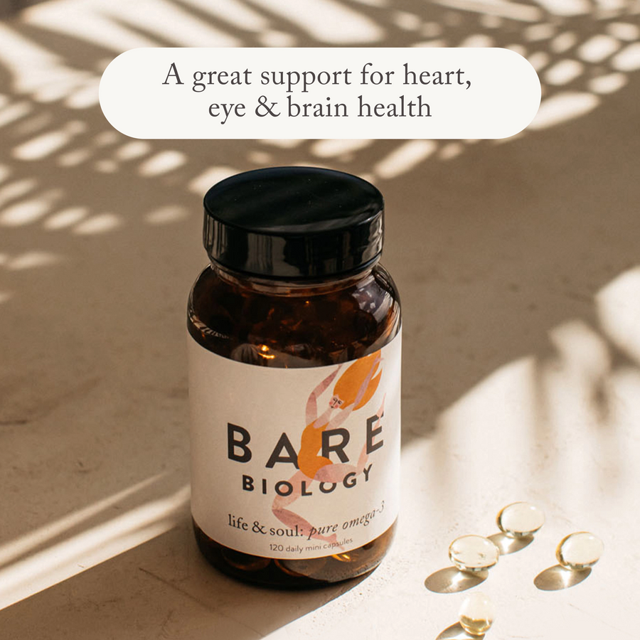 bare biology life & soul mini omega 3 fish oil jar and capsules on a sunny table with shadows of a plant